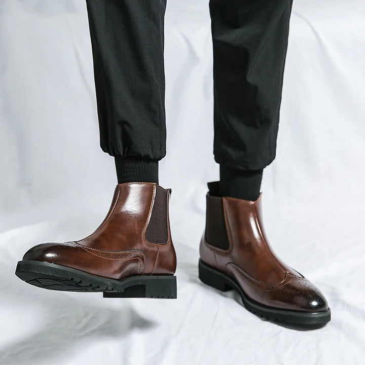 Men's black Chelsea dress boots, sleek and comfortable for formal events or smart office wear.
