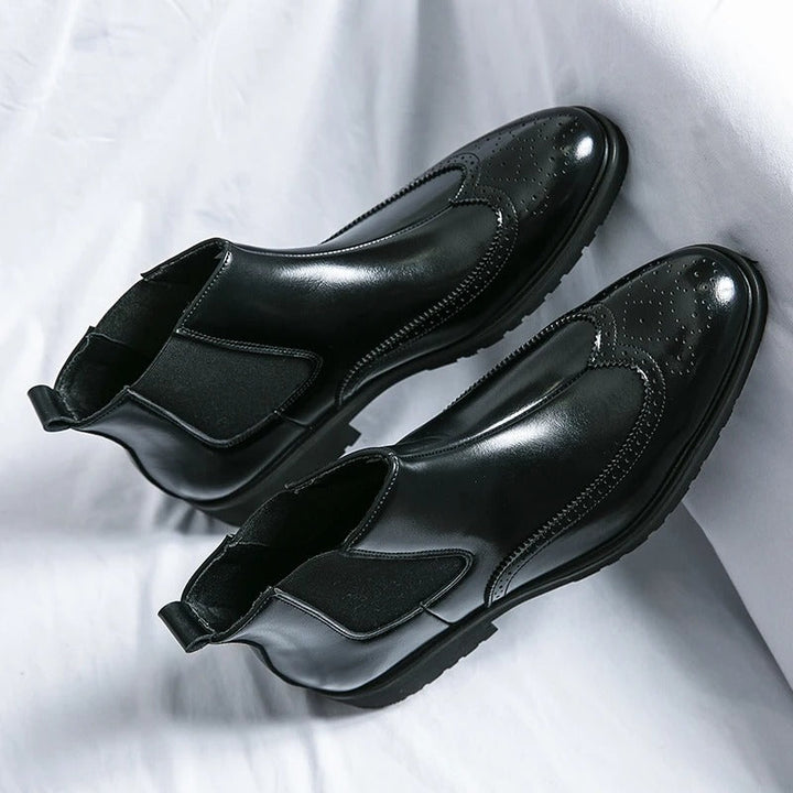 Stylish men's brown Chelsea boots, a comfortable staple for versatile men's fashion.
