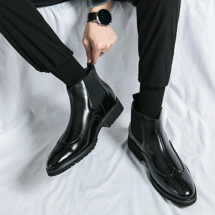 Classic men's brown Chelsea boots, a comfortable and stylish choice for any contemporary man.