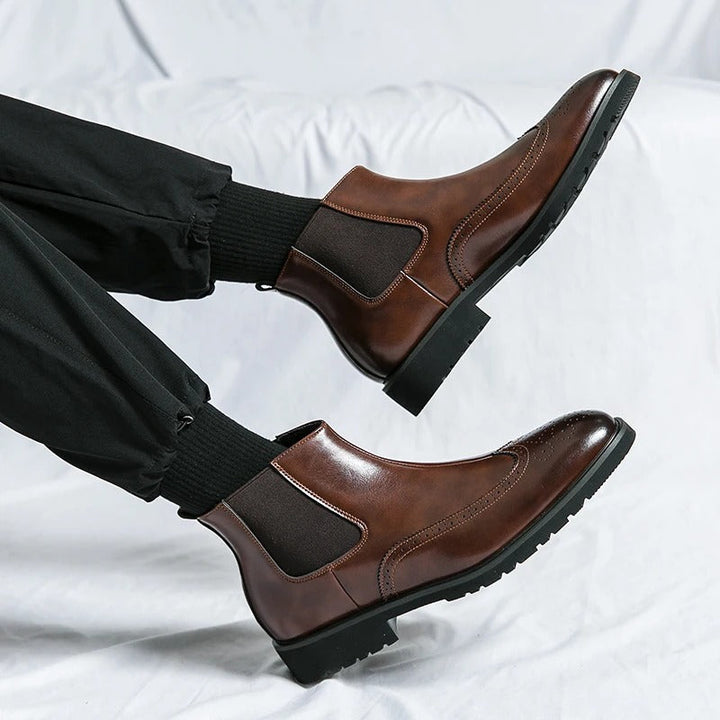 Stylish men's brown leather Chelsea boots, offering a timeless look with slip-on ease & comfort.