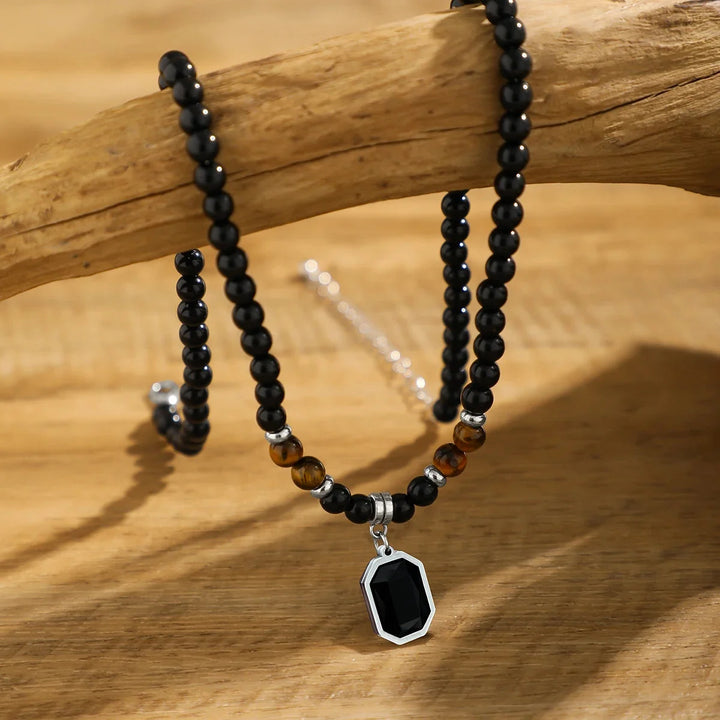 Handcrafted mens black onyx beaded necklace, accented with vibrant tiger's eye stones. Modern stone jewelry.