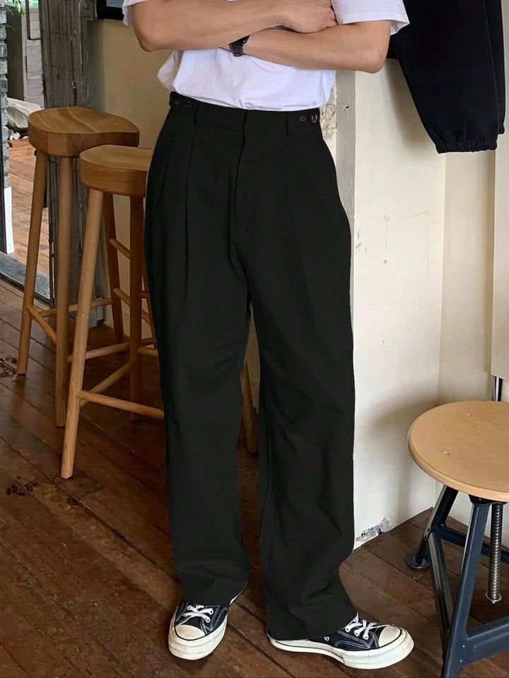 Black men's pleated wide-leg trousers, tailored for a modern high-rise fit. Comfortable business casual pants.