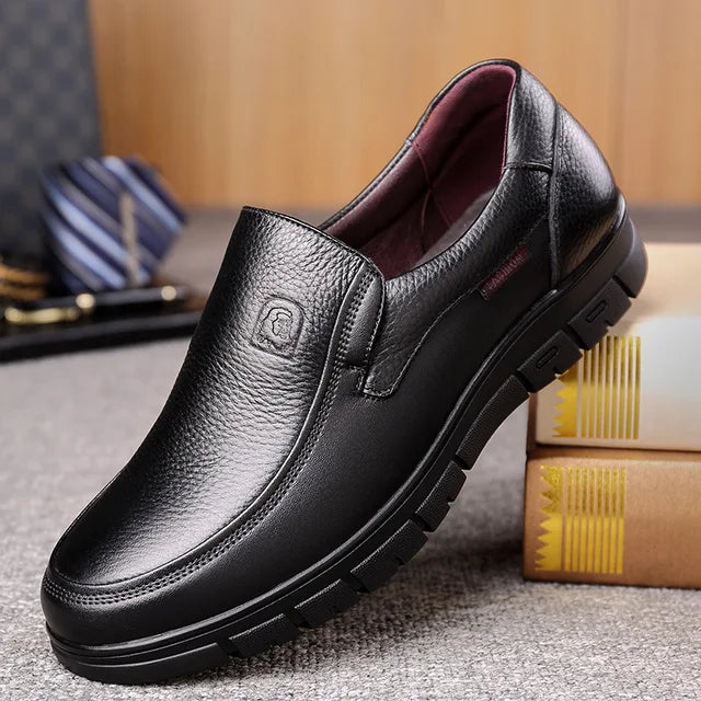 Stylish brown men's slip-on loafers, perfect for versatile everyday wear & casual comfort. Easy-on footwear.