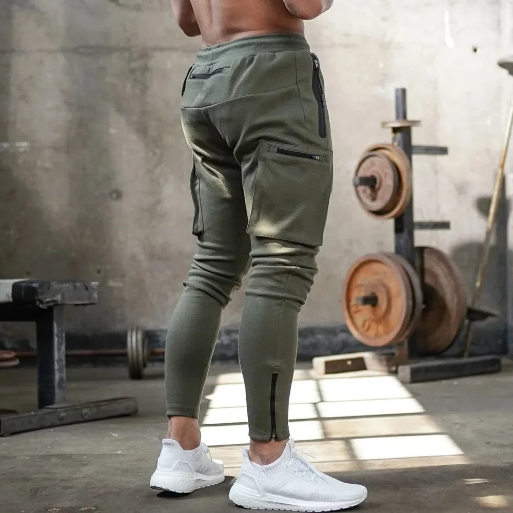 Grey activewear joggers for men, tactical style, sweat-wicking & breathable for workouts.
