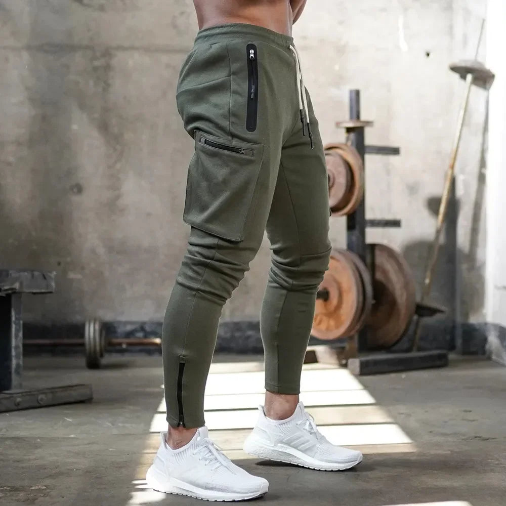 Durable men's training pants, cargo pockets, tapered fit, perfect for gym & outdoor activities.