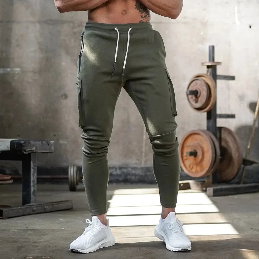 Blue men's utility joggers, stretch athletic wear, ideal for running, gym, and casual comfort.