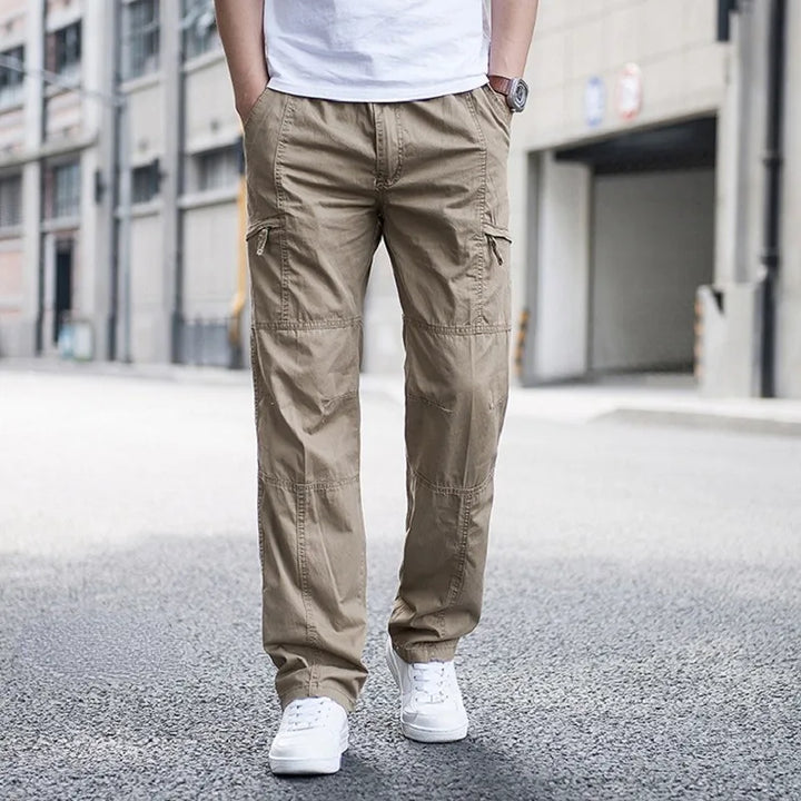 Khaki men's tech cargo pants, designed for comfort and versatile utility wear with practical pockets.