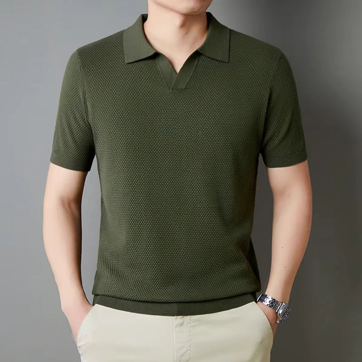 Model in a modern fit men's waffle knit polo shirt, showcasing comfortable stretch fabric.