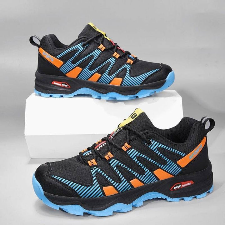 Men's outdoor exploration shoes, lace-up, designed for comfort & durability on treks.