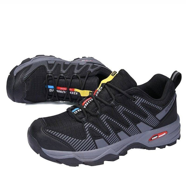 Athletic men's breathable shoes for hiking, grey, perfect for rugged outdoor terrain.
