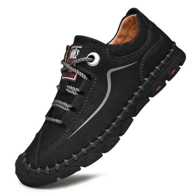 Close-up of men's breathable leather tactical hiking shoes, showing rugged soles