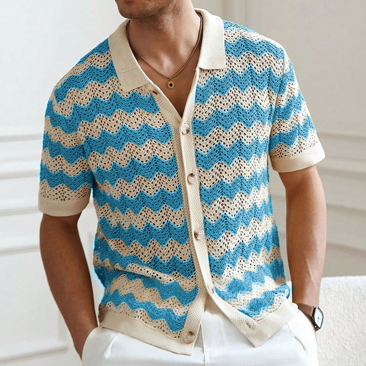 Blue men's short sleeve knit polo shirt. Breathable, textured fabric, relaxed fit for ultimate summer comfort.