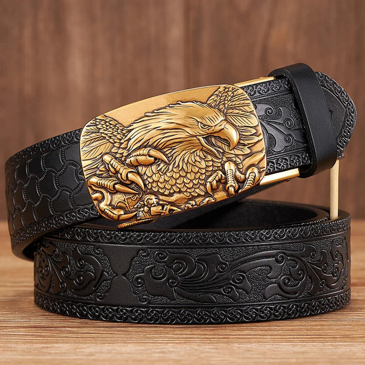 Black leather men's belt featuring an intricate silver embossed eagle buckle, a bold statement accessory.