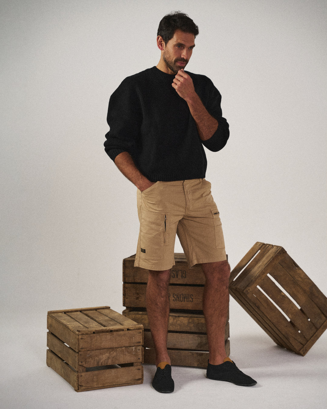Sleek black men's Cadiz cargo shorts, tailored fit, with practical utility pockets for daily casual wear & men's fashion.