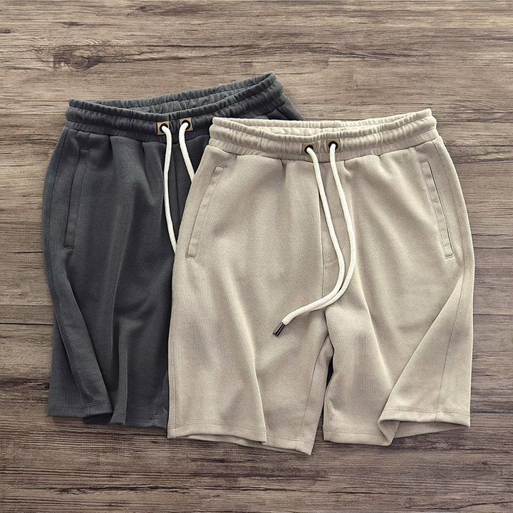 Black men's drawstring terry shorts for ultimate comfort. Great for athletic or casual summer wear.