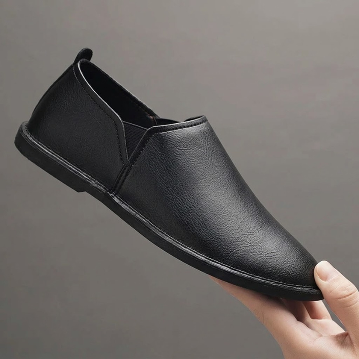 Side profile of men's Chester slip-on loafers, highlighting their sleek design and comfortable fit for men's fashion.