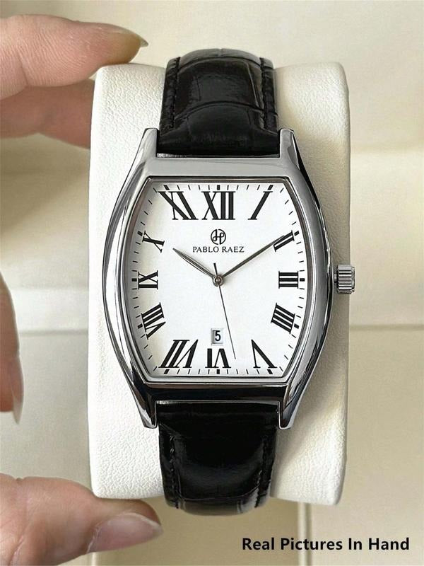 Close-up of men's elegant analog watch dial with date display, silver markers & hands.
