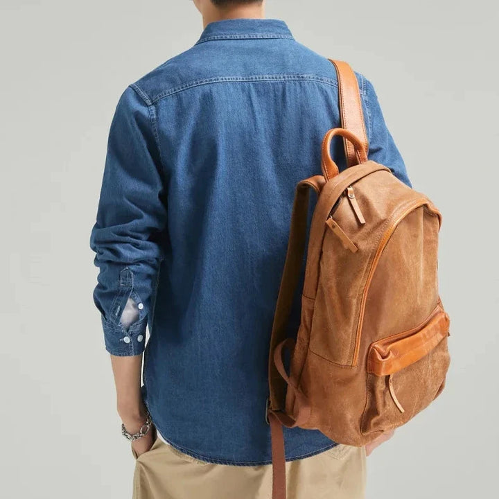 Men's long sleeve blue denim button-up shirt with chest pockets. Classic fit, perfect for casual style.
