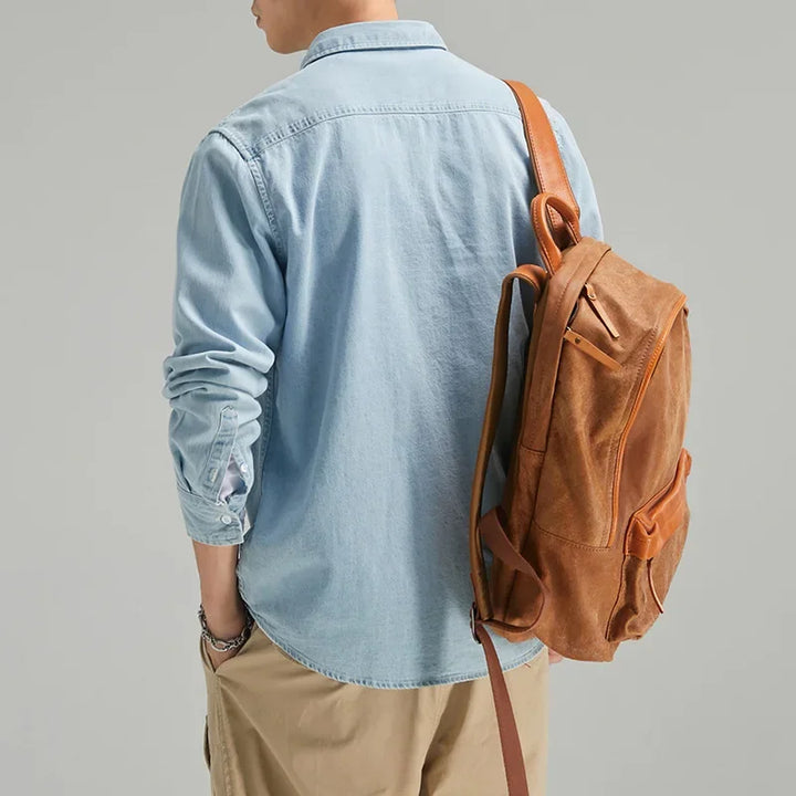 Versatile men's black denim button-up shirt. Timeless long sleeve design for classic casual wear.