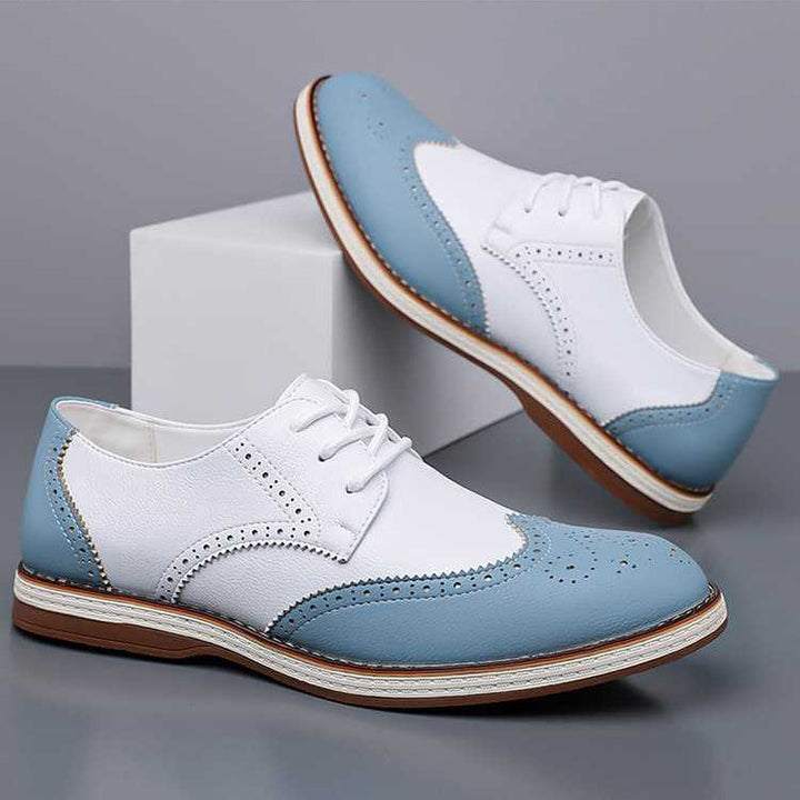Close-up of men's brogue dress shoes, showcasing elegant perforations and classic durable design.