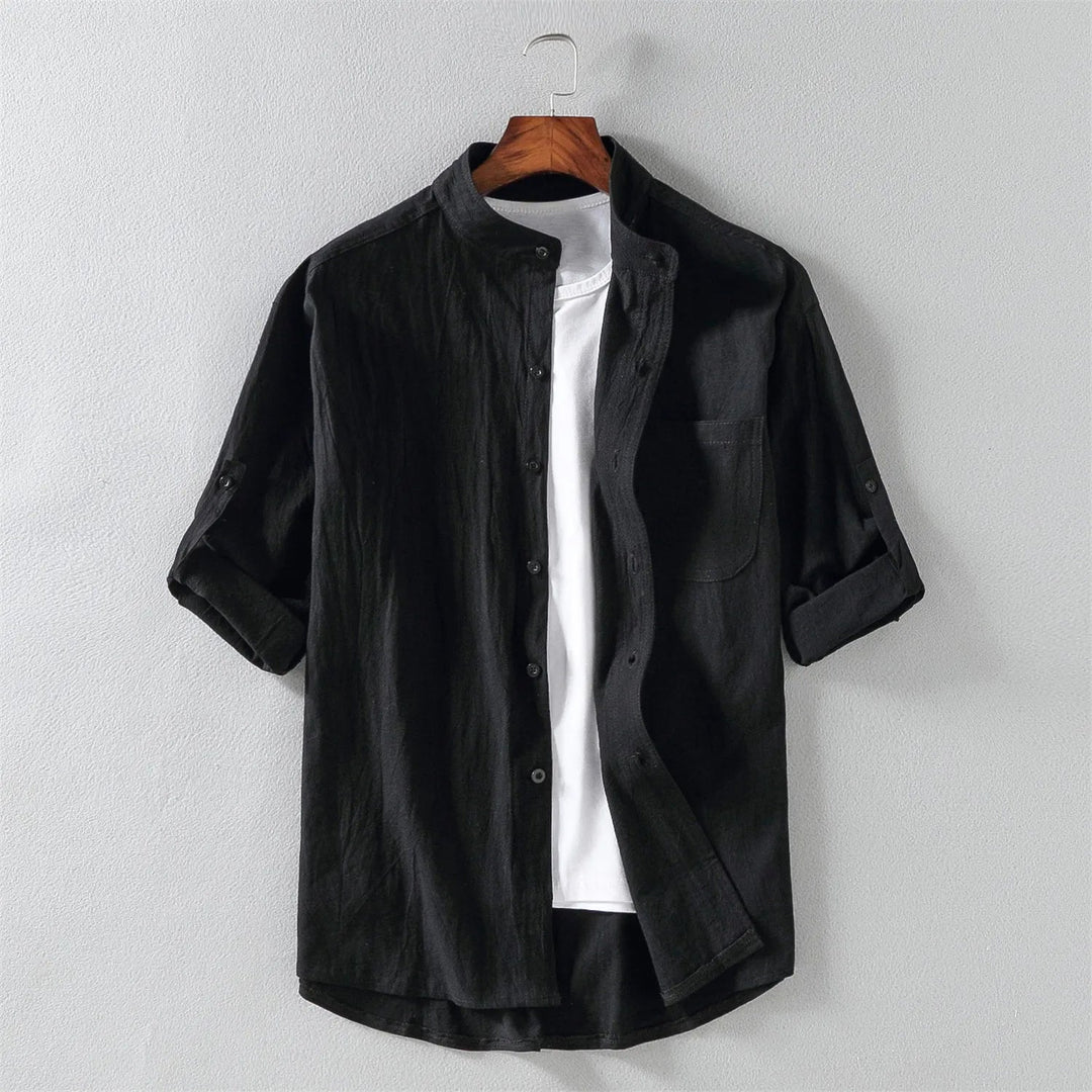 Man wearing a relaxed fit men's cotton button-up shirt, styled for comfortable and breathable everyday wear.