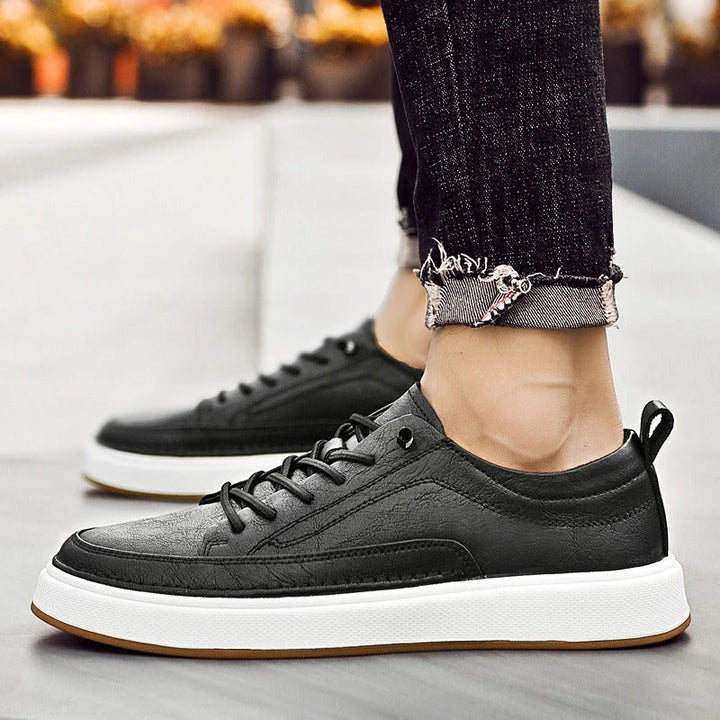 Stylish men's dark brown leather casual footwear, classic sneakers for urban comfort.