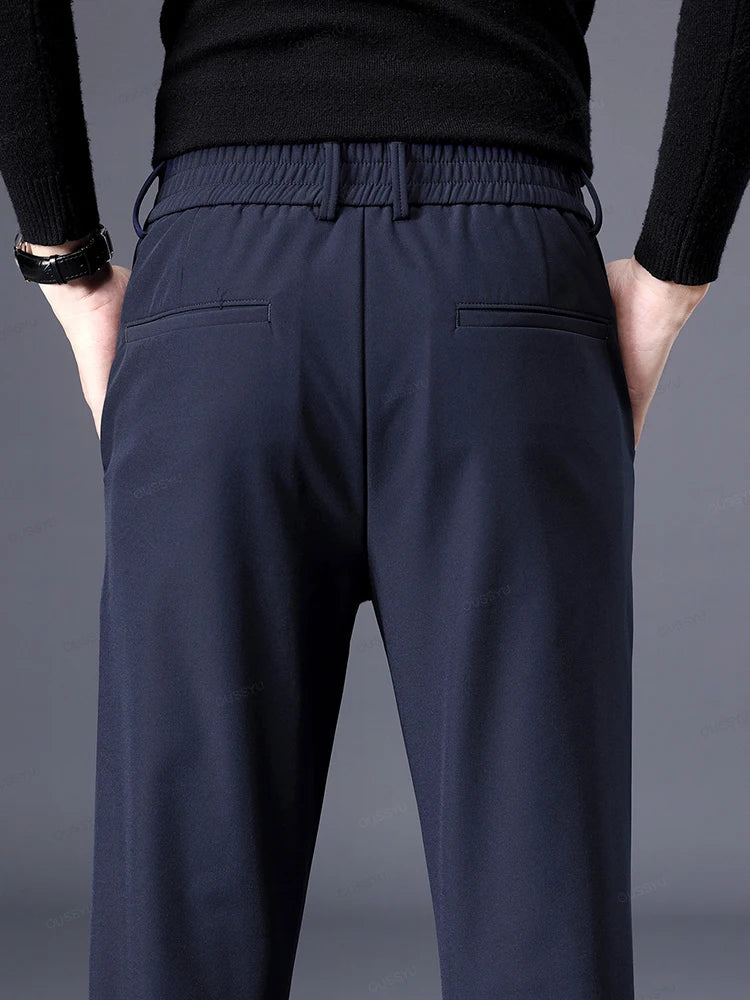 Black men's tailored dress pants, classic fit, featuring an elastic waist for all-day comfortable wear.