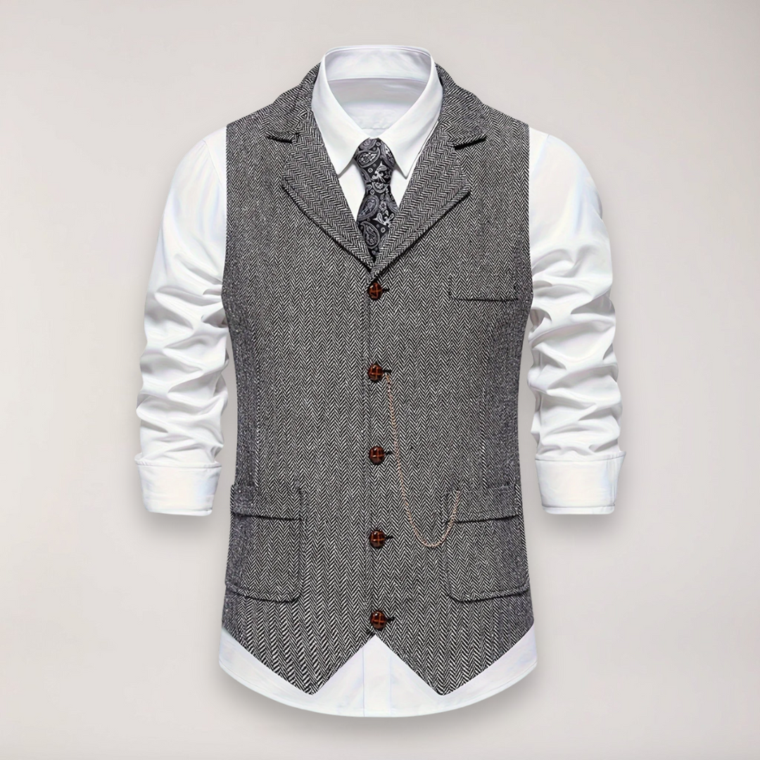 Men's formal herringbone waistcoat in a classic fit, paired with a shirt, enhancing a sophisticated smart casual ensemble.