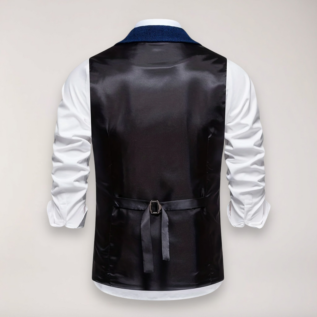 Front view of a men's herringbone waistcoat in classic fit, highlighting the elegant reversed collar and fabric texture.