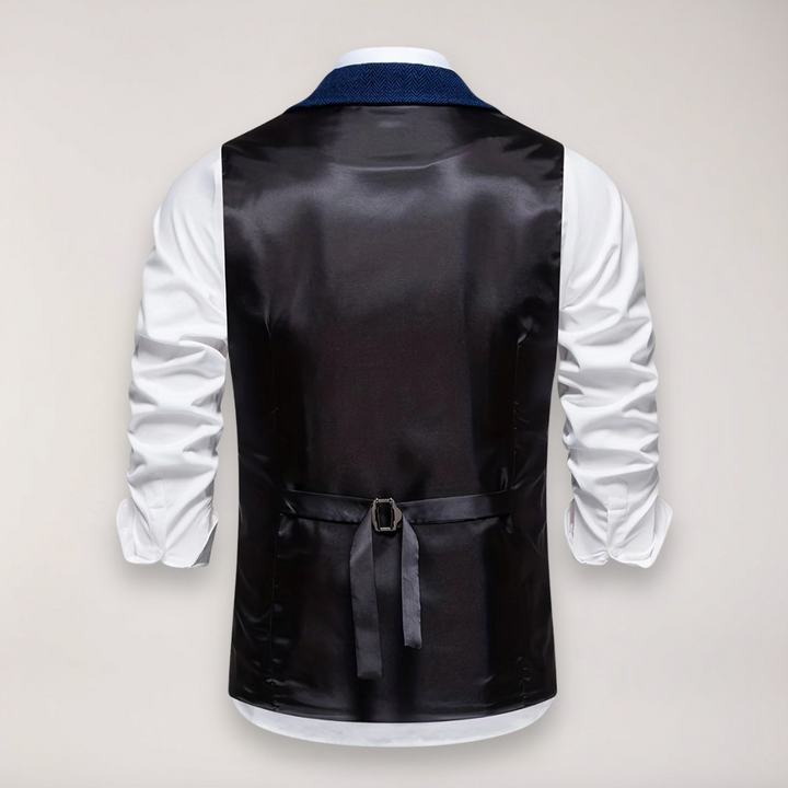 Front view of a men's herringbone waistcoat in classic fit, highlighting the elegant reversed collar and fabric texture.