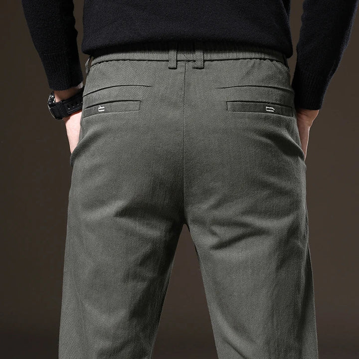 Black classic fit men's stretch trousers, tailored for style and wrinkle resistance.
