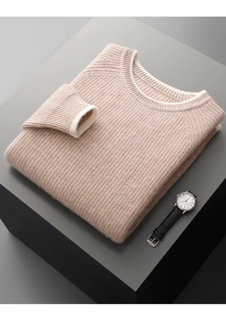 Detail shot of the ribbed crew neck on a men's classic long sleeve knitted sweater.