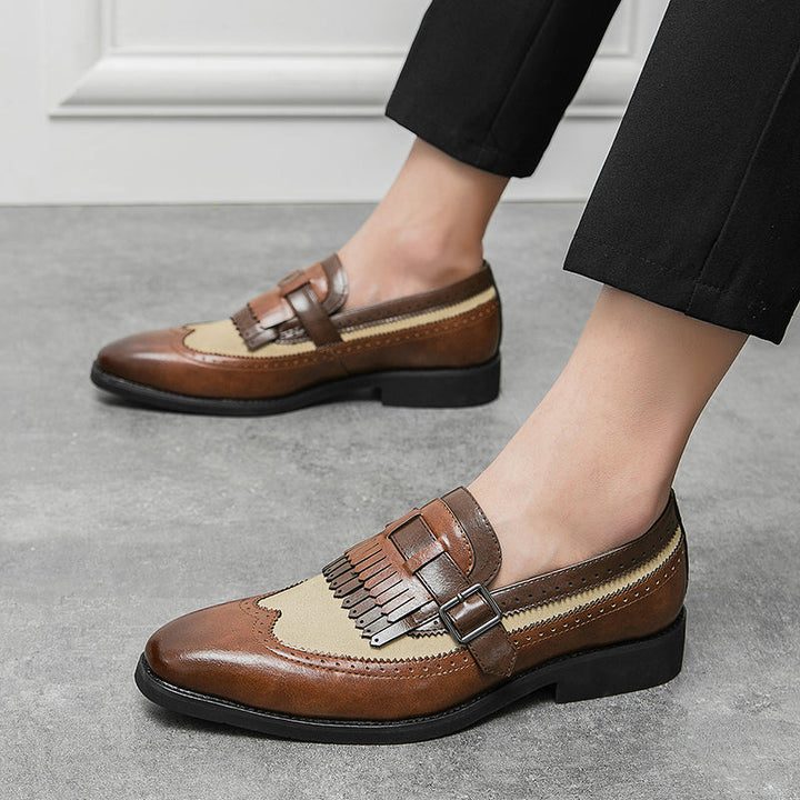 Sophisticated men's dress shoes: slip-on brogue loafers with a distinctive fringe.
