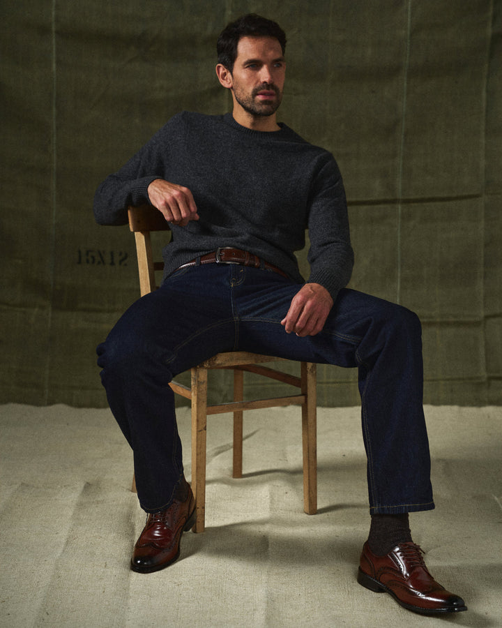 Sleek black leather Oxford brogues, men's dress shoes offering classic style & comfort for formal occasions.