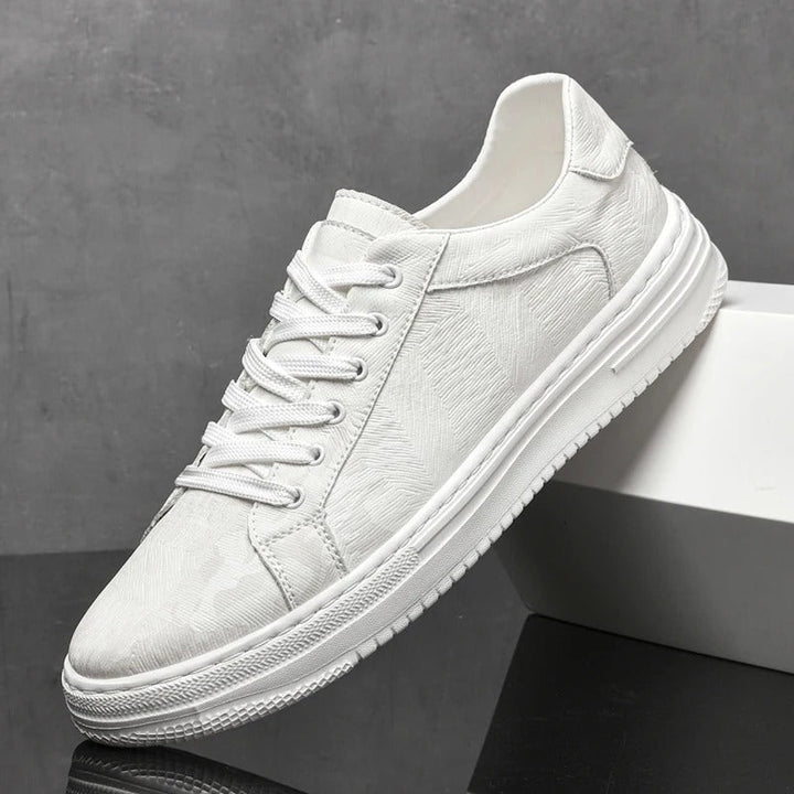 Assortment: men's classic leather sneakers in black, sand & white. Versatile, comfortable casual shoes.