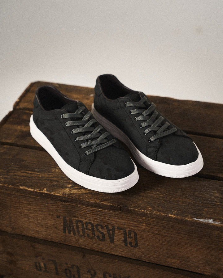 Black men's classic leather sneakers. Stylish, comfortable casual shoes for everyday wear.