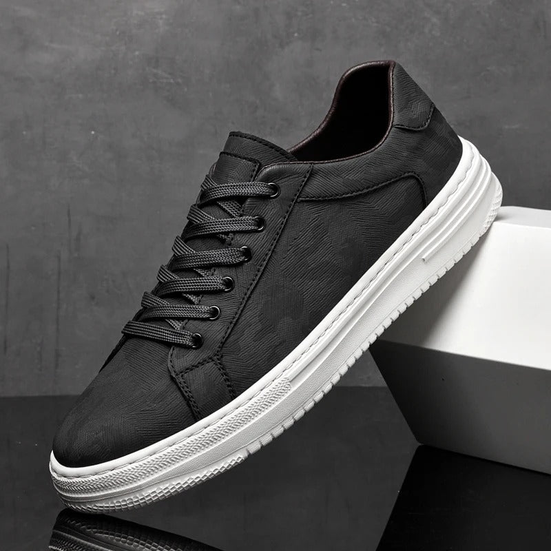 Stylish men's classic leather sneakers. Versatile casual leather footwear in black, white & sand options.