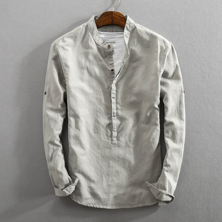 Men's classic long-sleeve button-up shirt in a versatile solid color, perfect for comfortable everyday wear.