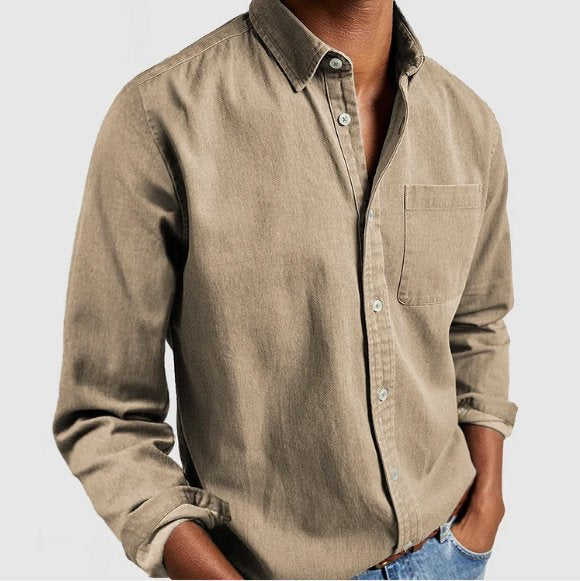 The crisp collar of a men's classic long sleeve button-up shirt, a versatile and essential piece of menswear.
