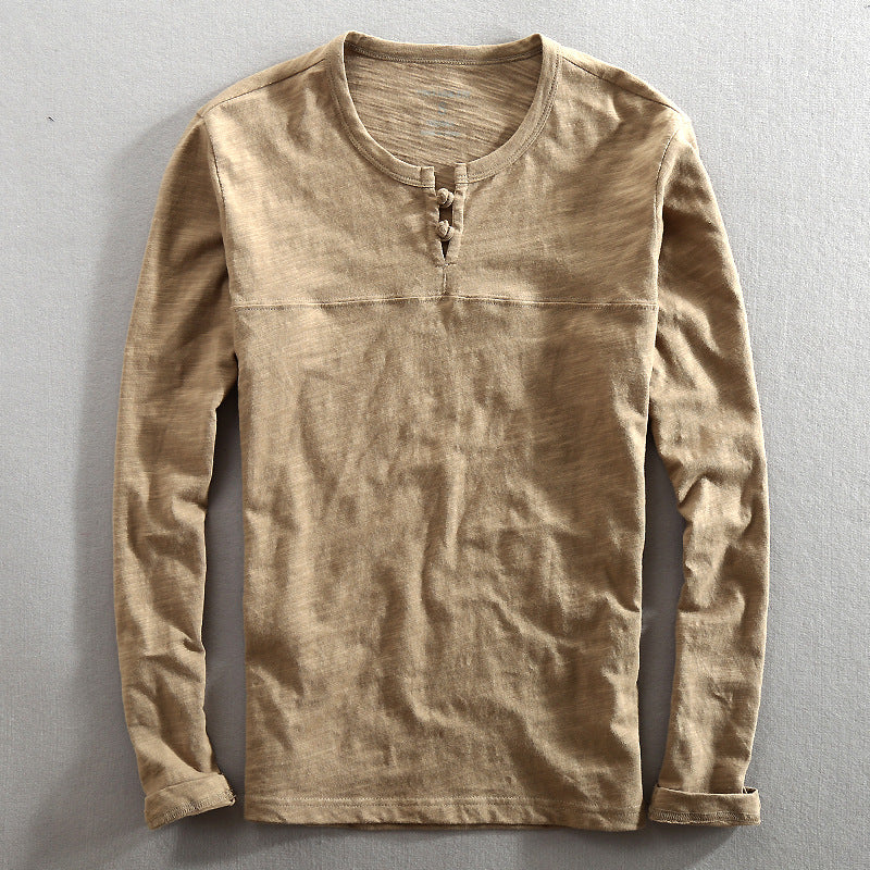 Men's classic long sleeve Henley shirt in gray, perfect for casual wear and everyday comfort. A versatile wardrobe essential.