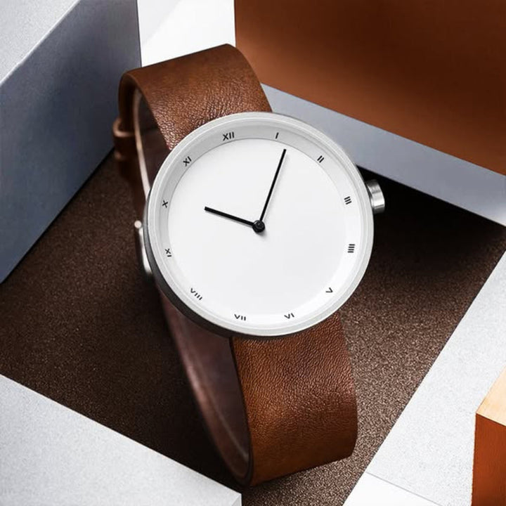 Gentleman's timeless leather strap watch, minimalist design, perfect men's accessory for any occasion.