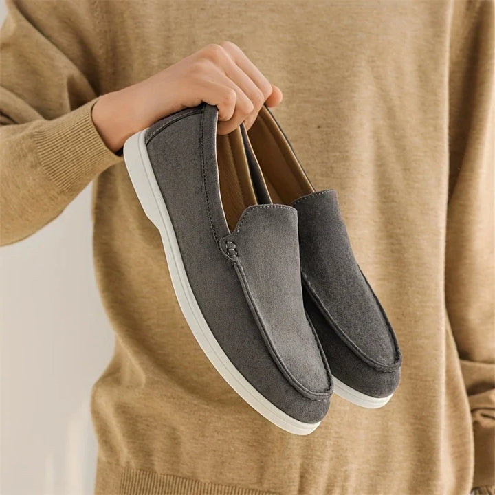 Side view of men's classic comfort loafers, versatile slip-on shoes for various occasions.