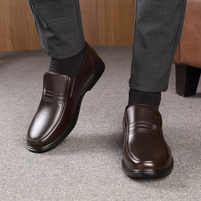 Classic men's brown slip-on loafers, a timeless choice for business, formal, and elegant fashion.