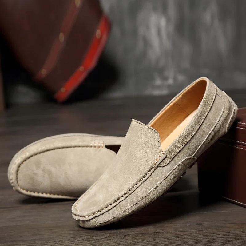 Stylish navy men's slip-on loafers, perfect for comfortable everyday casual and dress wear.