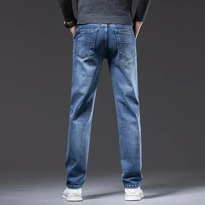 Vintage blue men's straight fit denim jeans, a timeless casual wear essential for men's fashion.