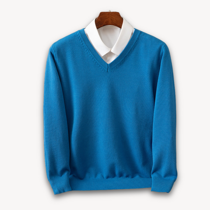 Sleek men's V-neck sweater for a classic, versatile layered look, perfect for casual or formal occasions.