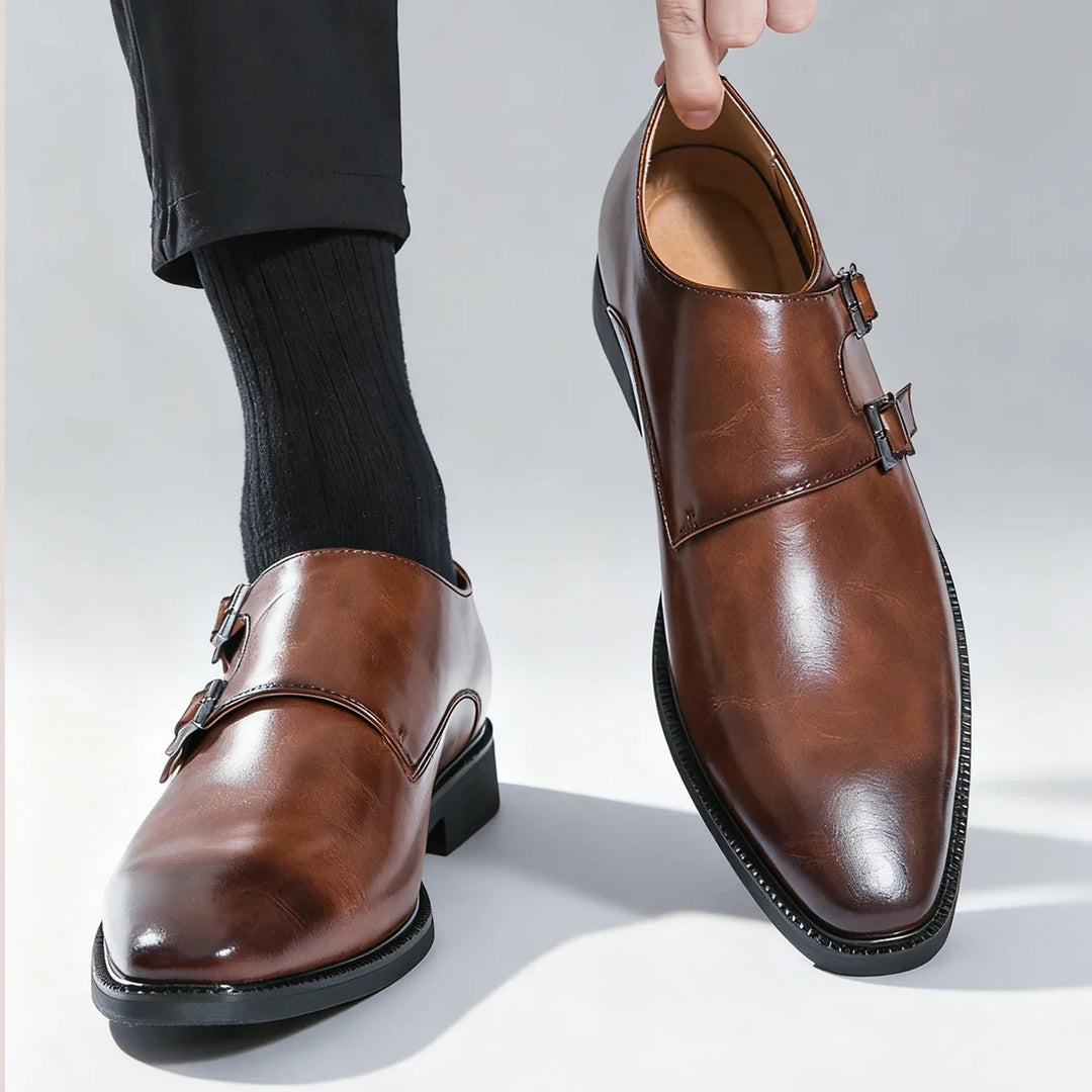 Stylish black Valmont buckle loafers for men. Classic slip-on formal shoes for comfortable wear.