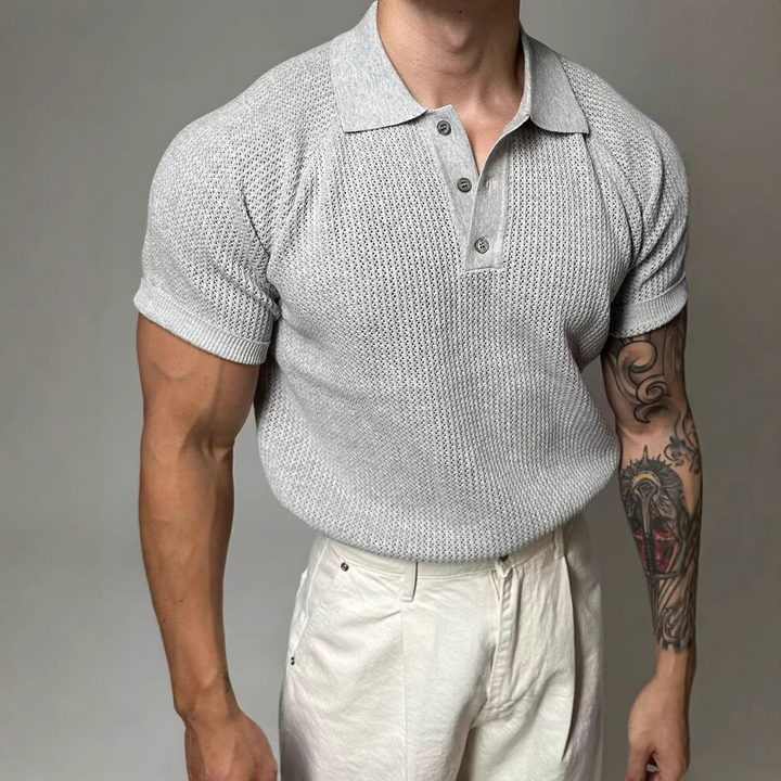 Everyday men's fashion: classic waffle polo shirt with structured collar for a stylish look.
