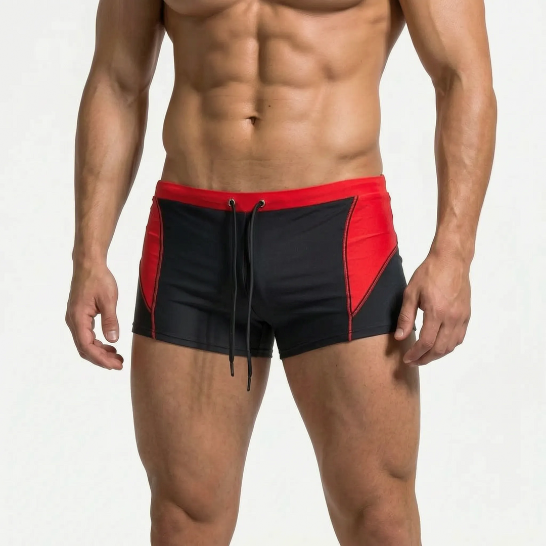 Modern athletic men's color block boxer swim trunks. Quick-dry swimwear for performance & style.