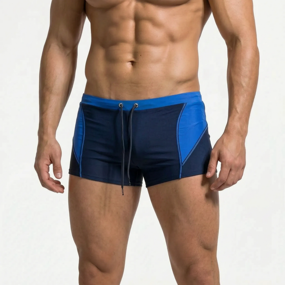 Men's trendy color block swim trunks, essential beachwear for vacation, pool, or watersports fun.